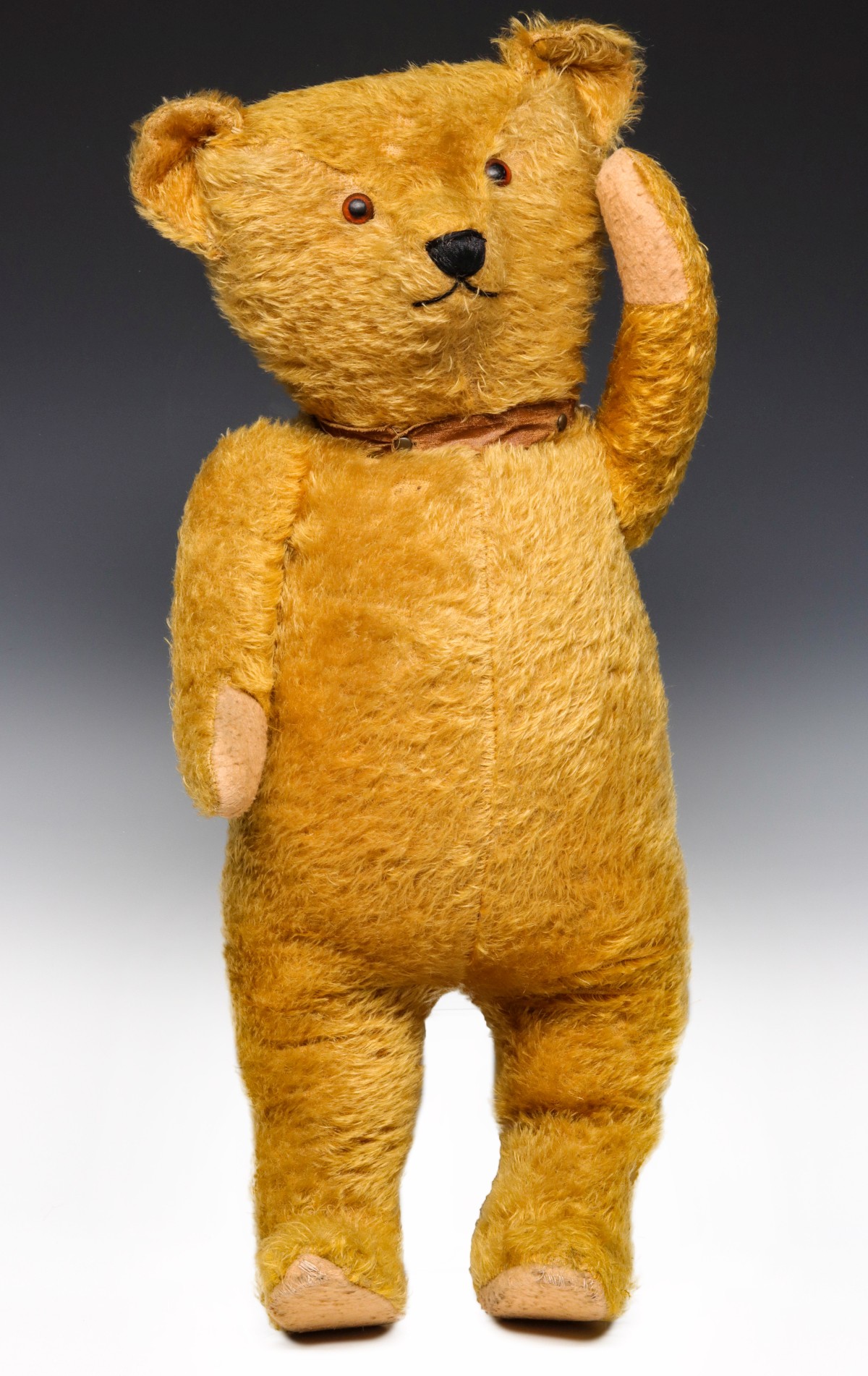 AN ANTIQUE 24-INCH GOLD MOHAIR STANDING TEDDY BEAR