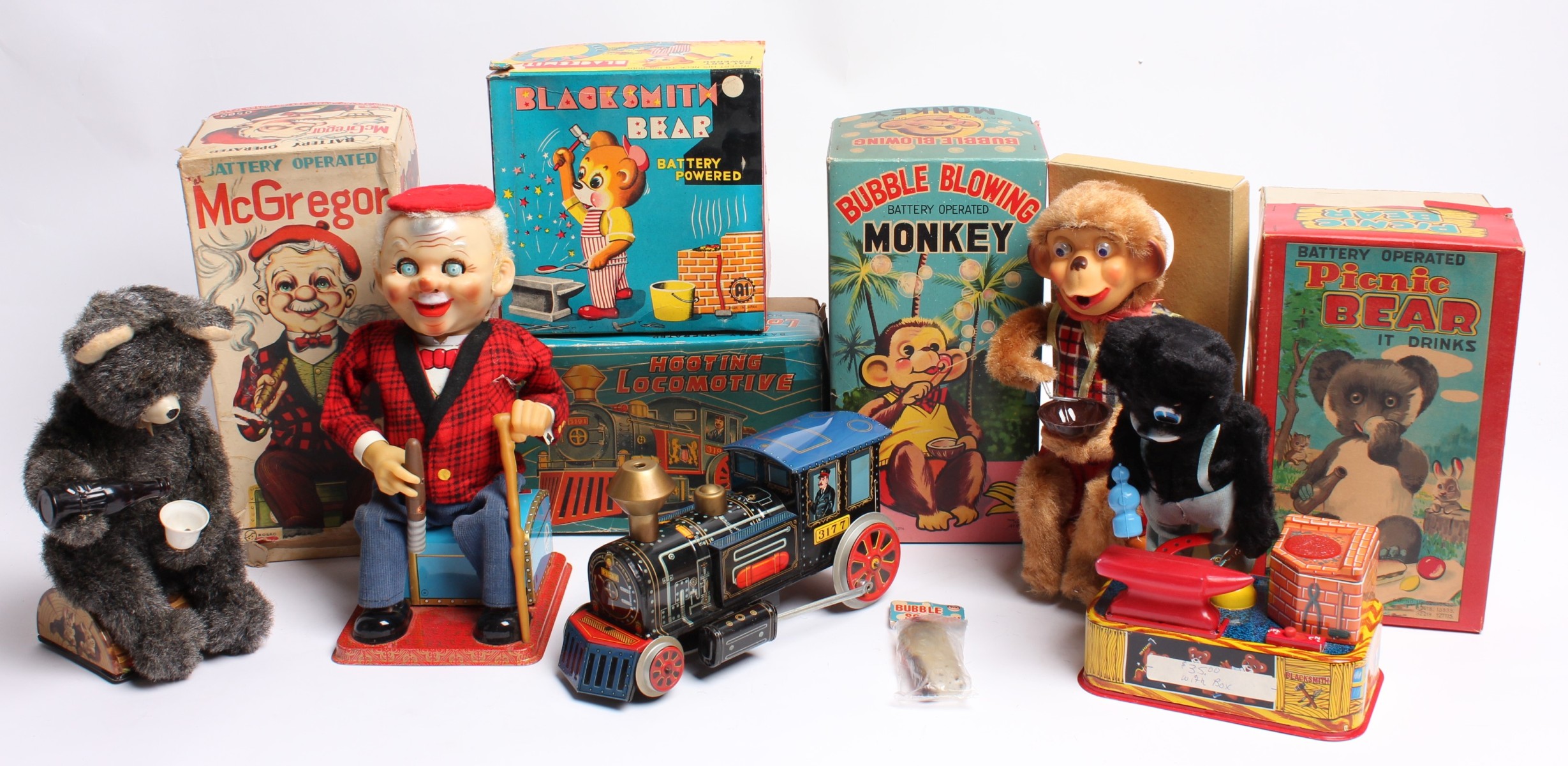 FIVE VINTAGE BATTERY OPERATED TOYS IN ORIGINAL BOX