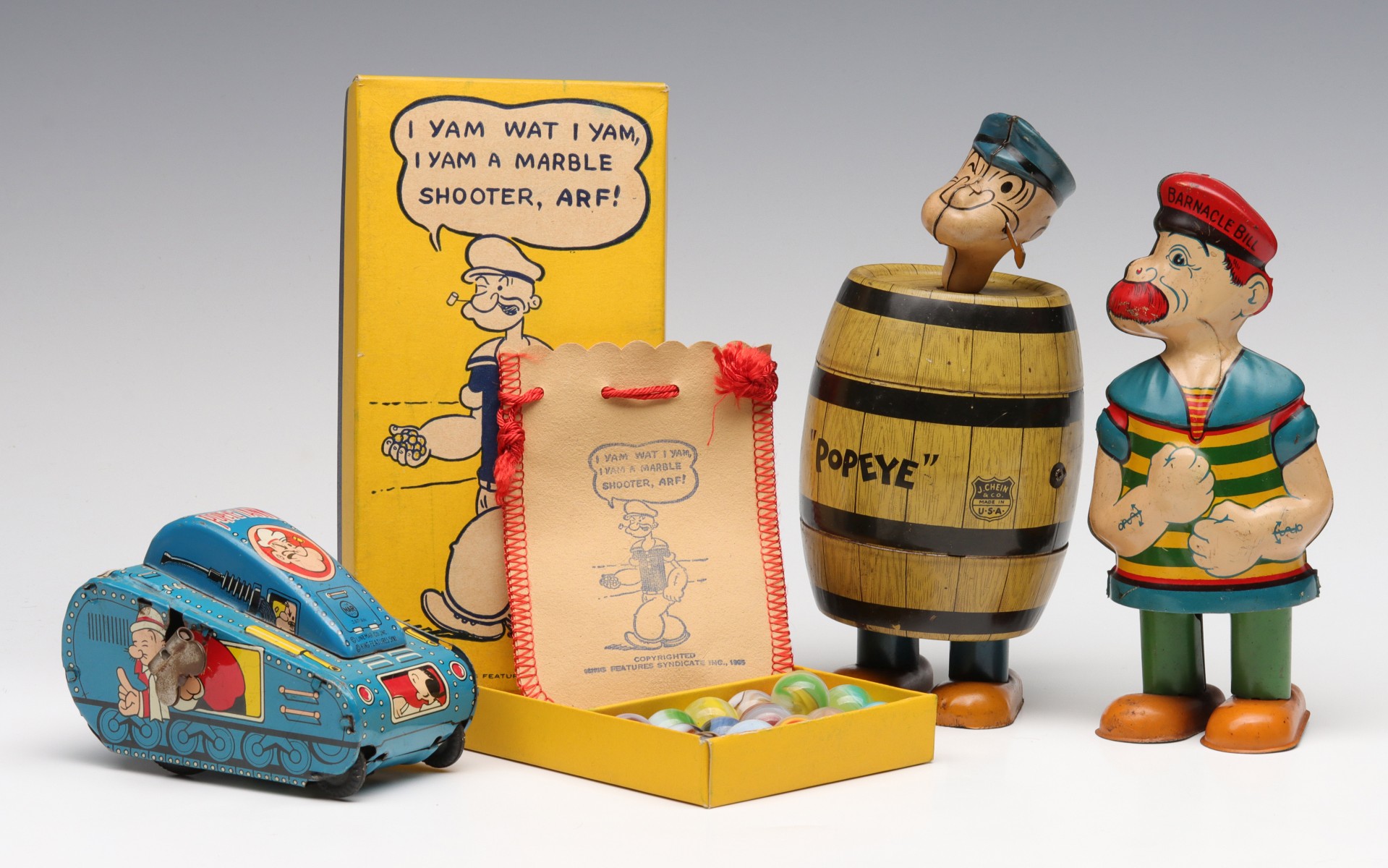 A COLLECTION OF POPEYE THEME TOYS AND 1929 MARBLES