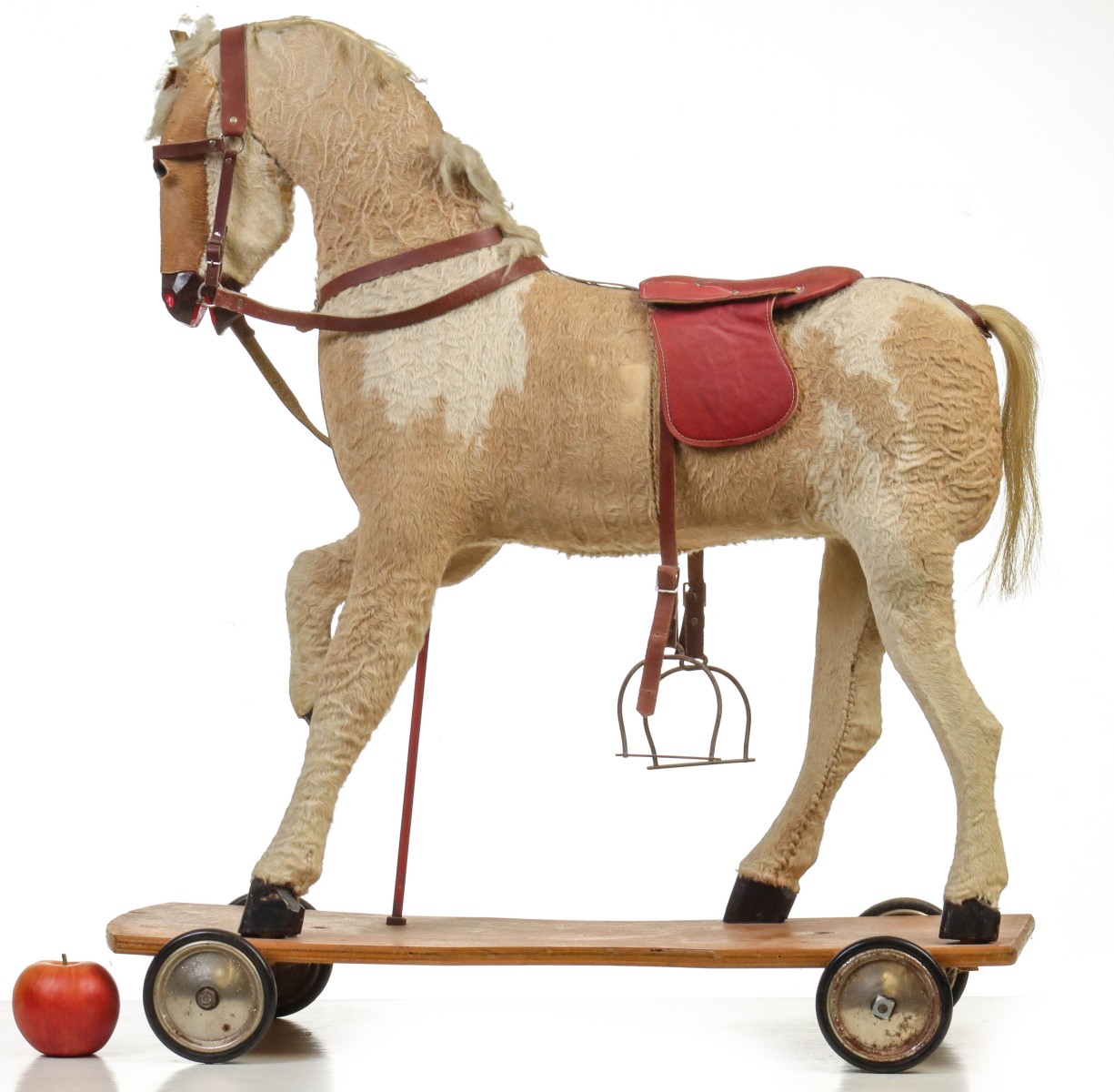 A LARGE MID-20TH CENTURY RIDE-ON PLATFORM HORSE