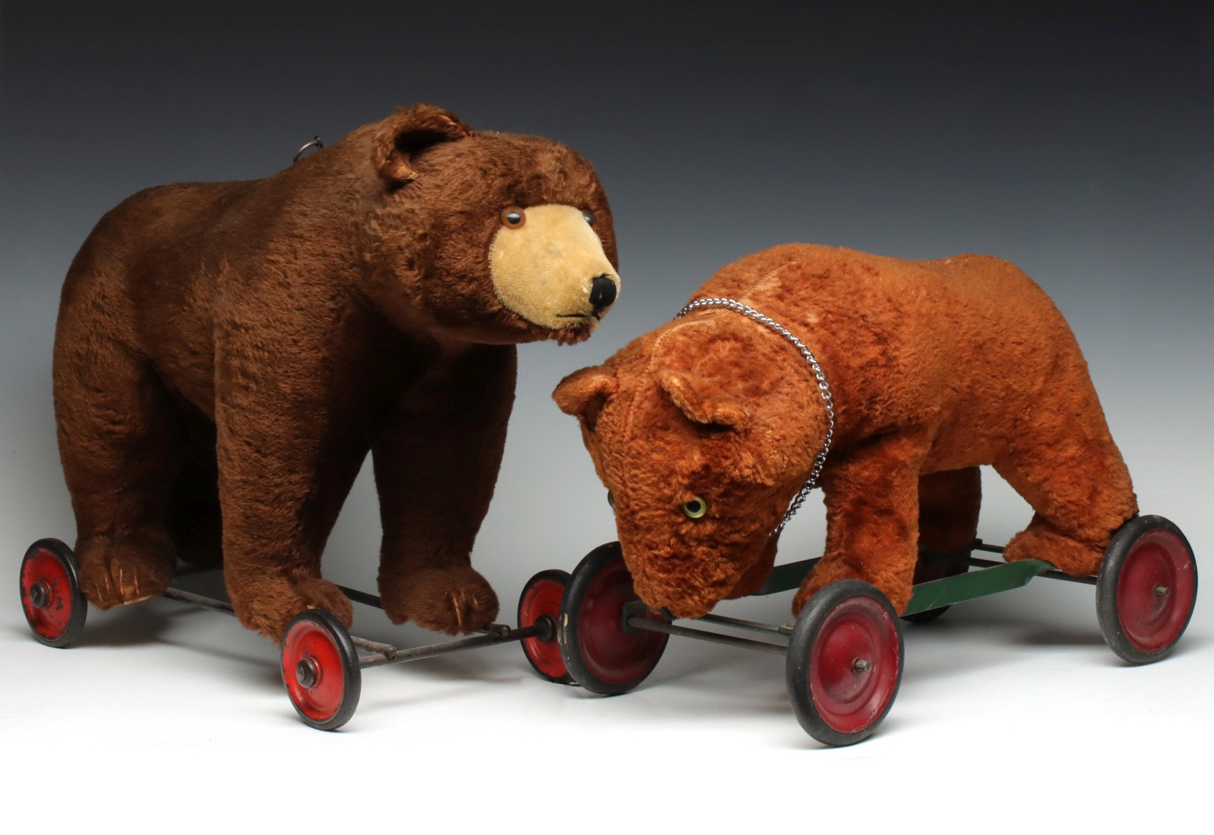 TWO EARLY 20TH CENTURY BEAR ON WHEELS PULL TOYS