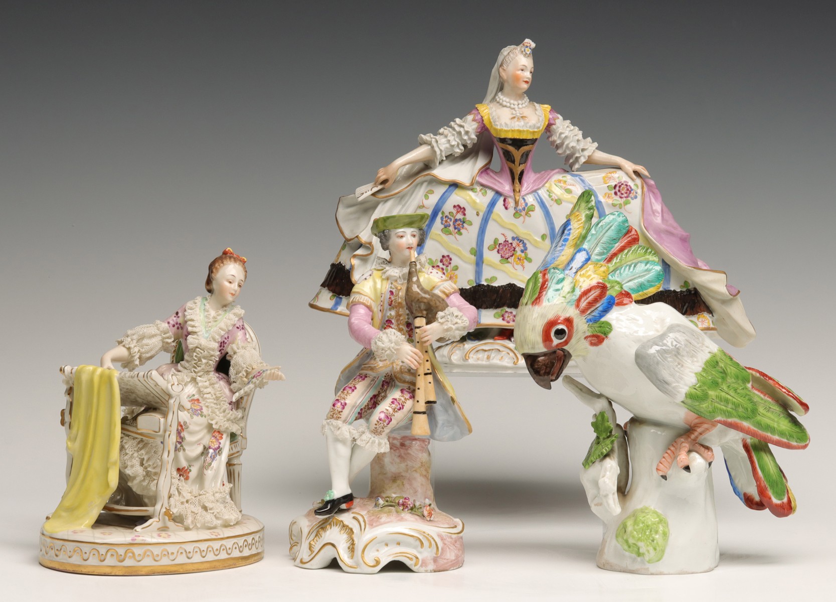 A COLLECTION OF FOUR CONTINENTAL PORCELAIN FIGURES