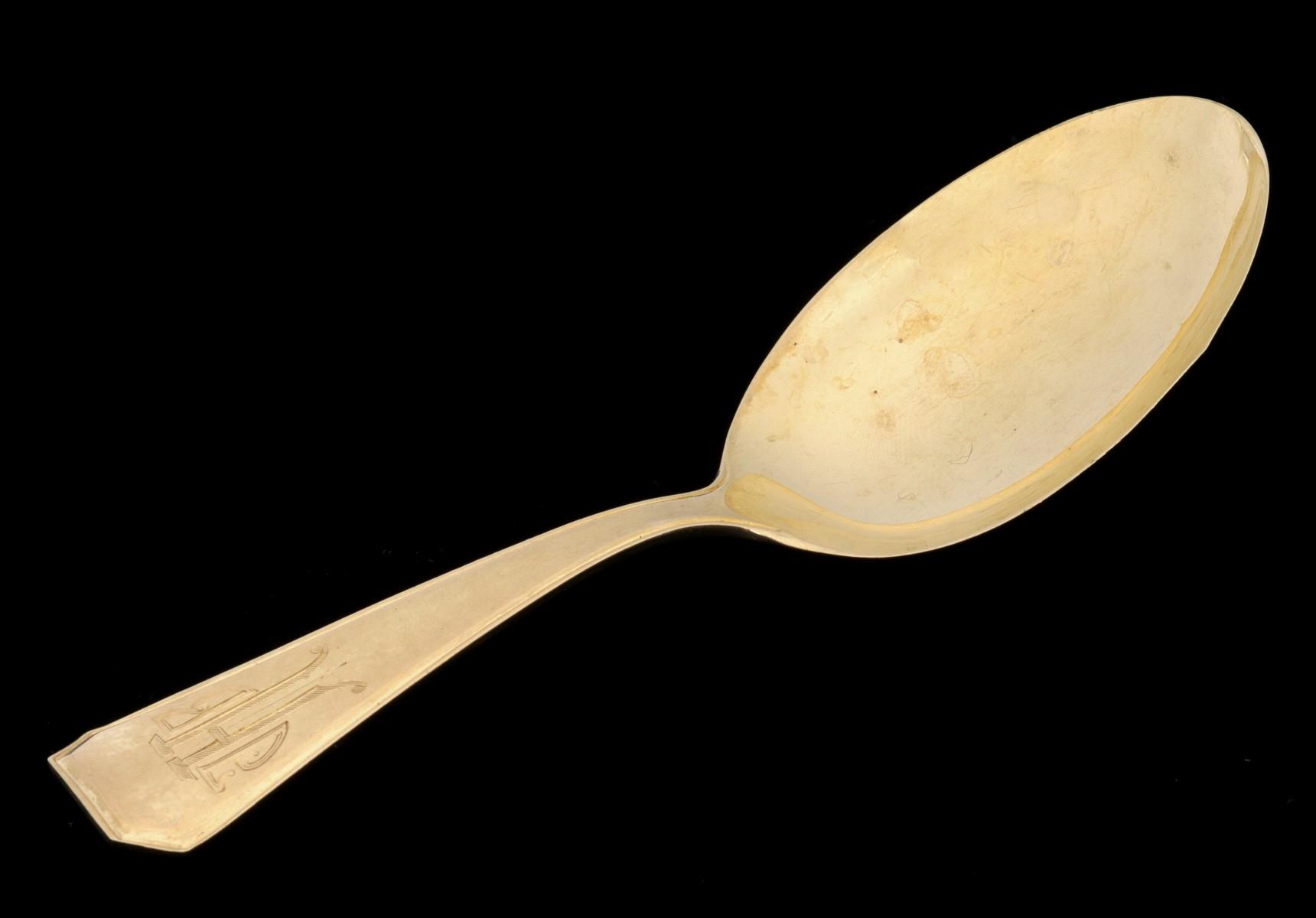 A SOLID 14K GOLD CHILD'S FEEDING SPOON DATED 1930