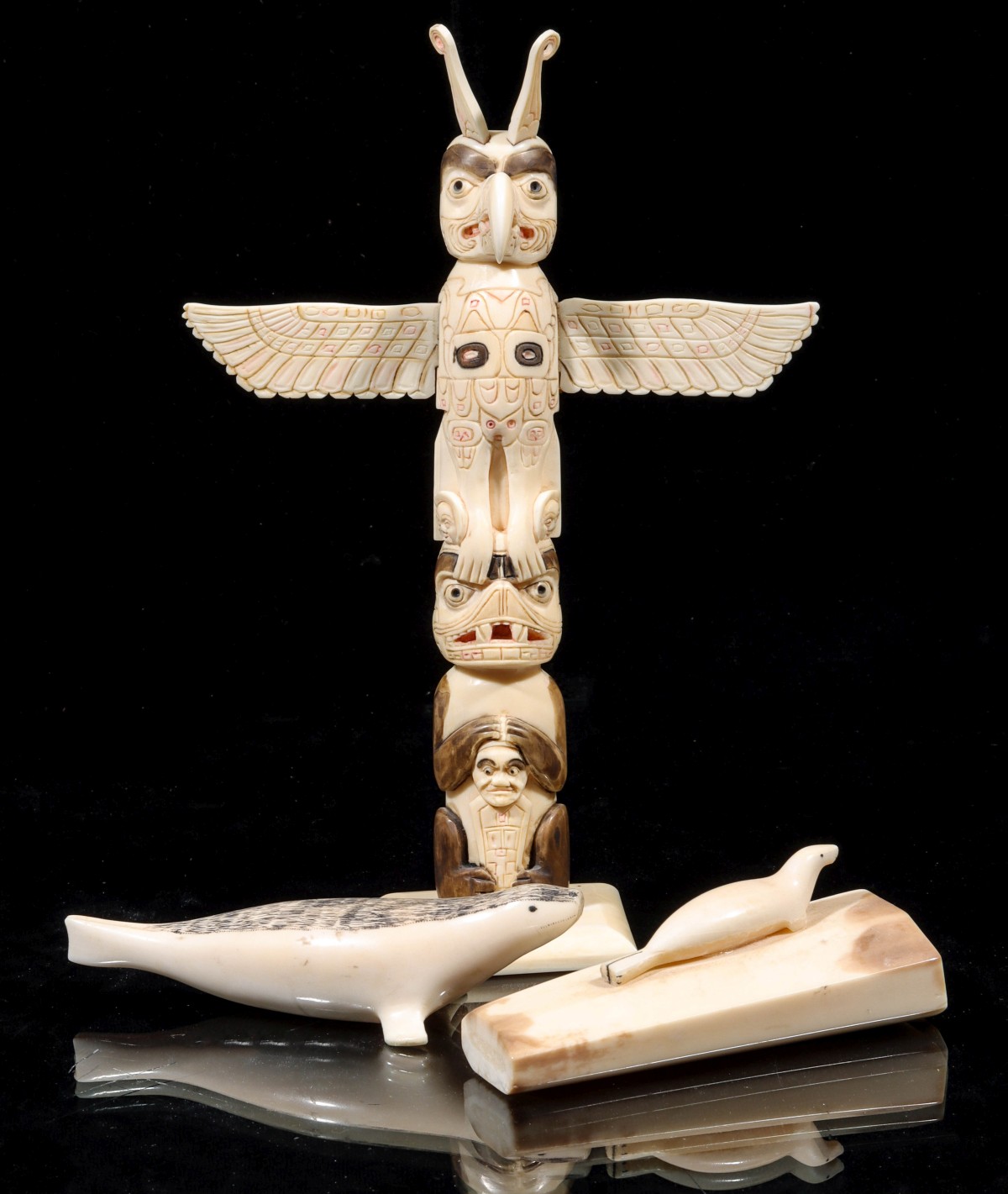 THREE NATIVE INUIT CARVINGS INCLUDING A TOTEM POLE