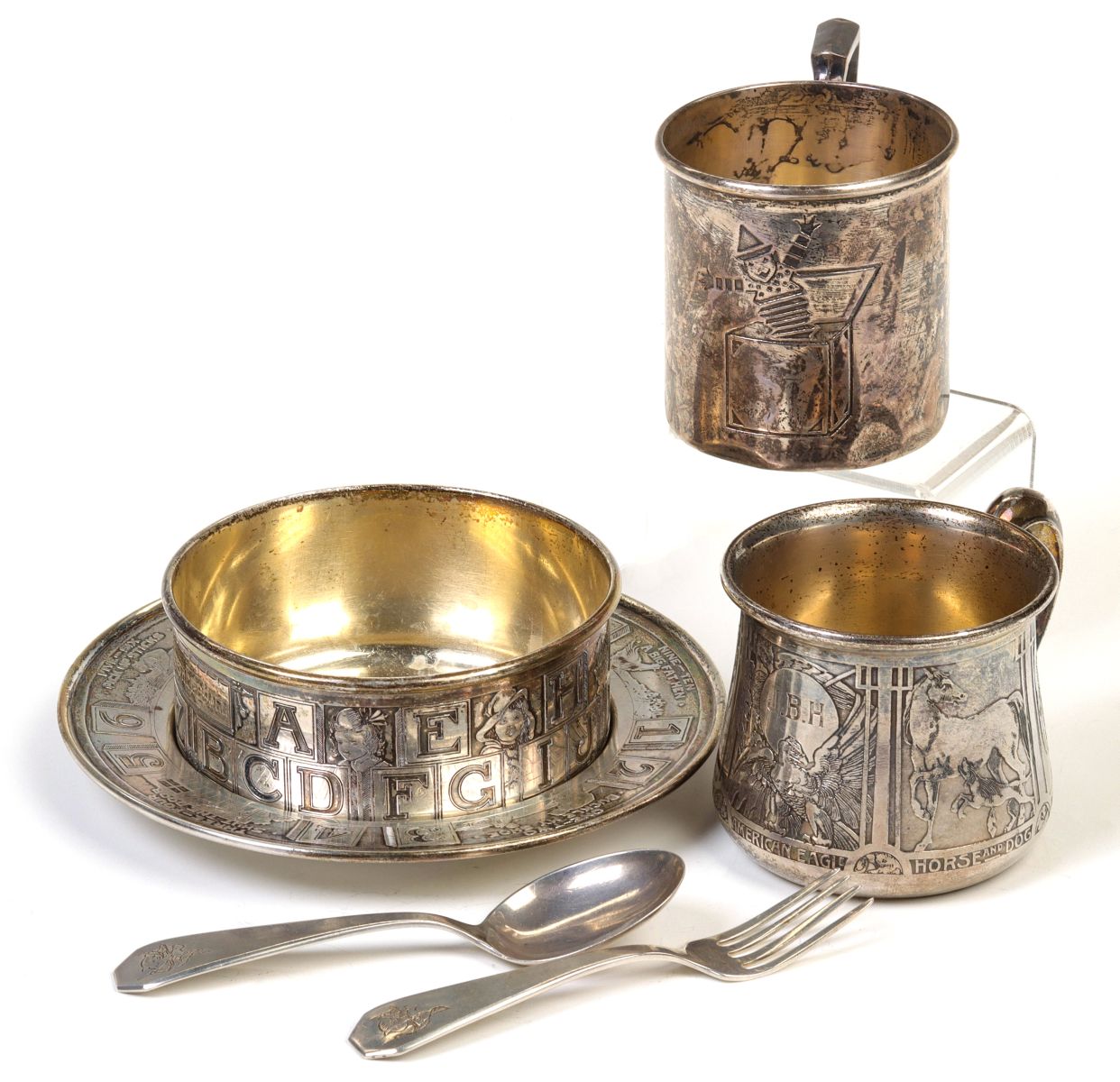 A COLLECTION OF 1930s SCULPTED SILVER CHILD'S DISHES