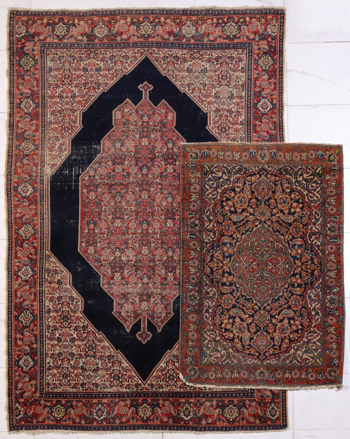 TWO PERSIAN RUGS INCLUDING ANTIQUE SENNEH