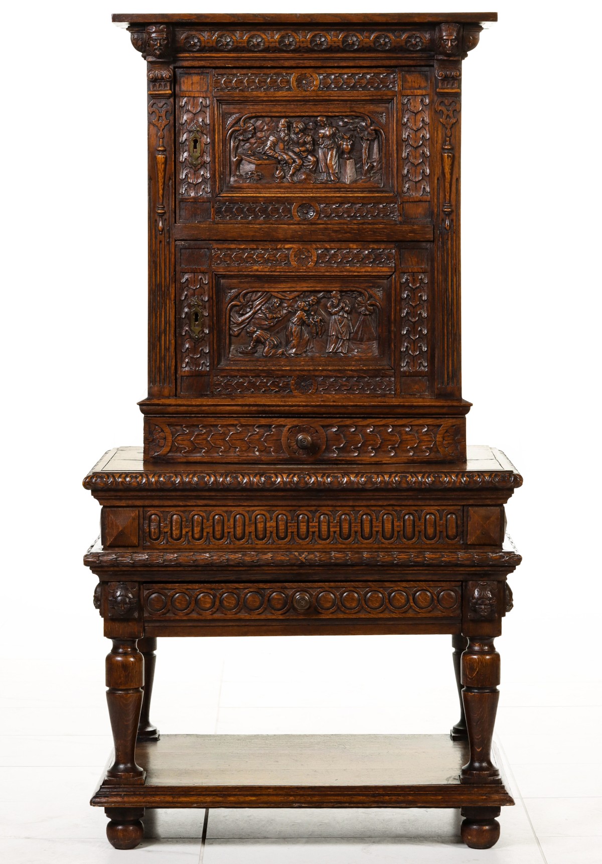AN EARLY 20TH CENTURY CARVED OAK COURT CABINET